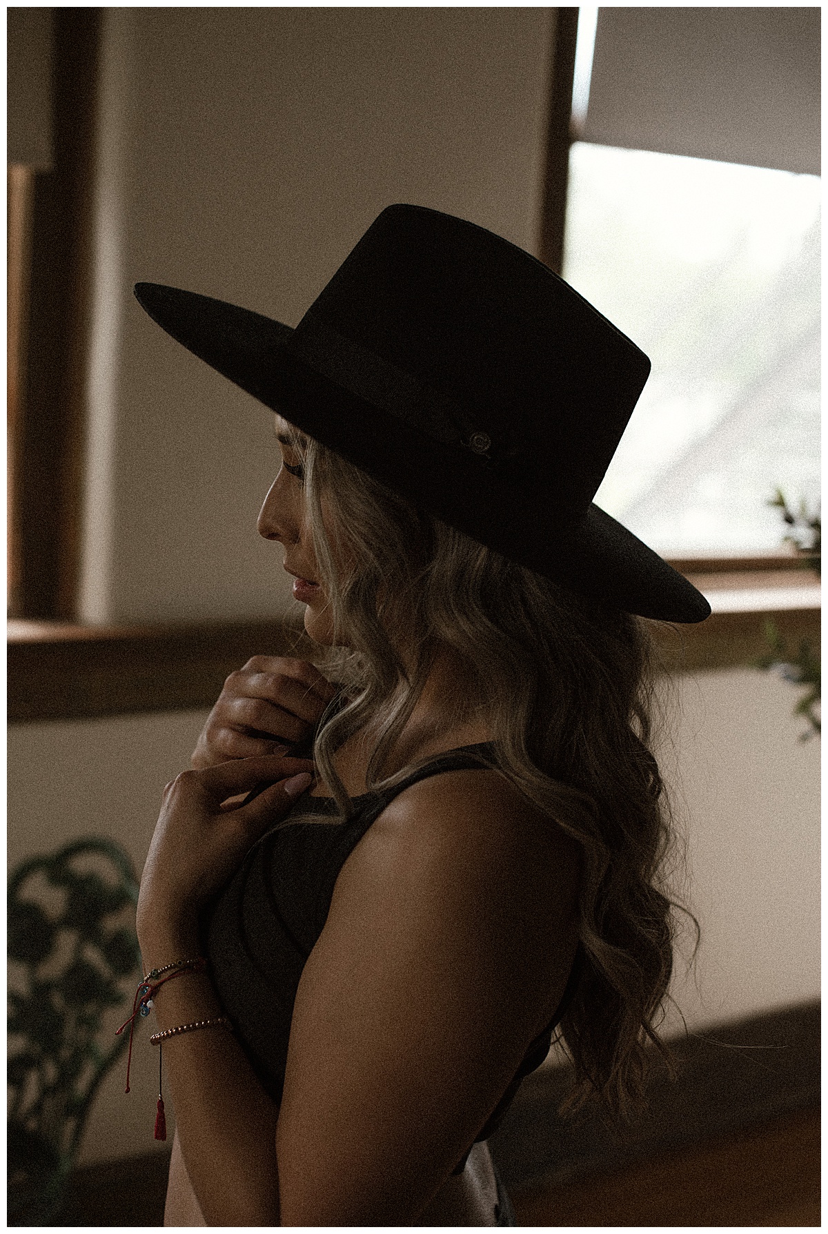 Woman wears cowboy hat showing off a fun Lingerie Theme 