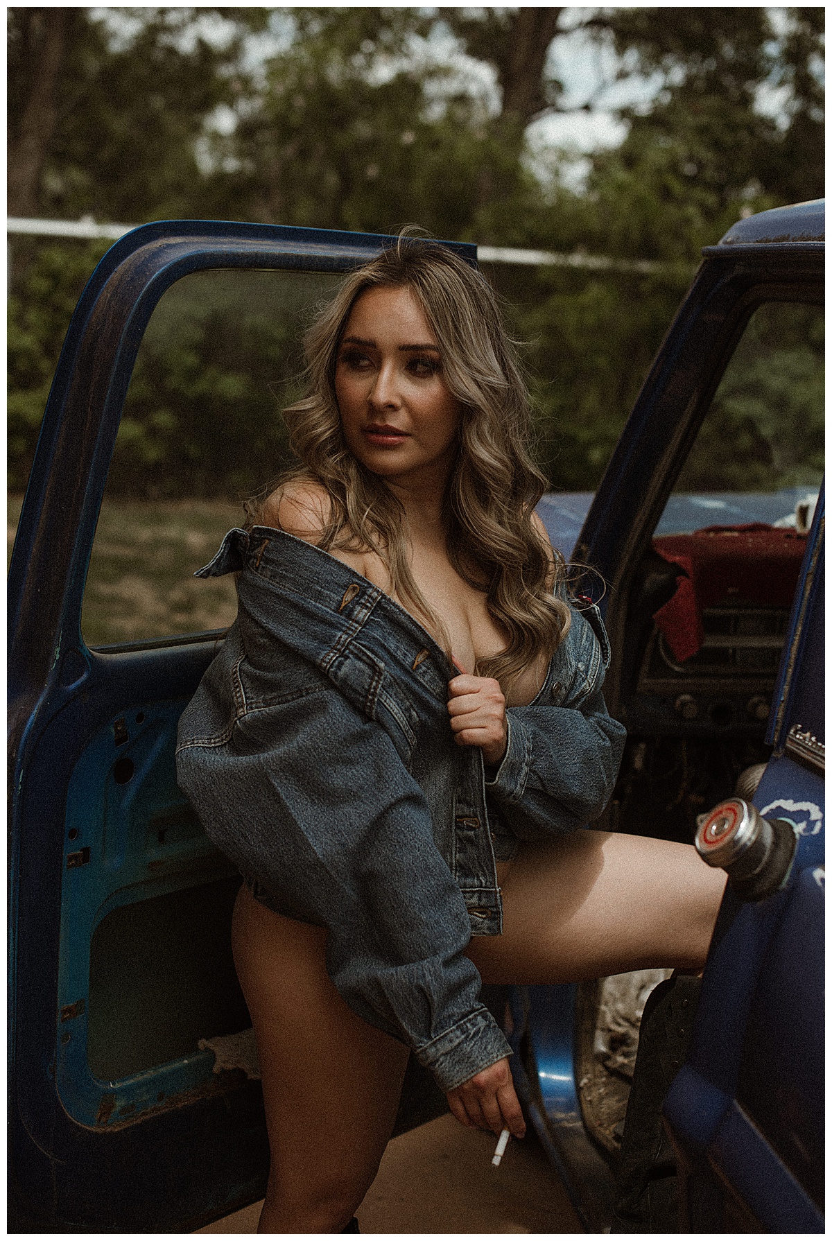 Adult wears jean jacket for Colorado Boudoir Photographer